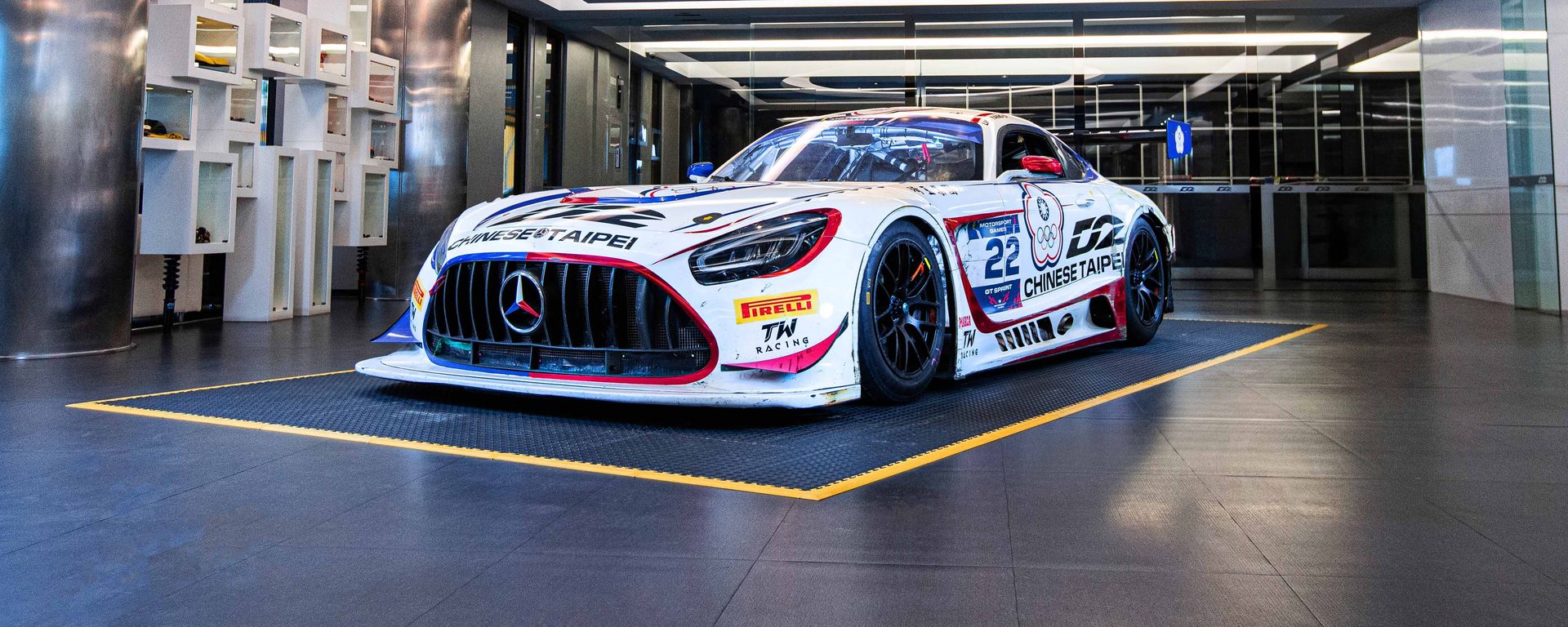 TW Racing race car in the headquarters showroom