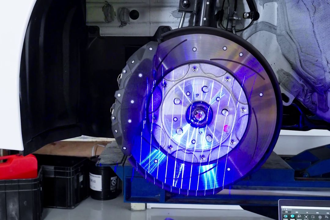 Laser scanning a brake rotor on the car