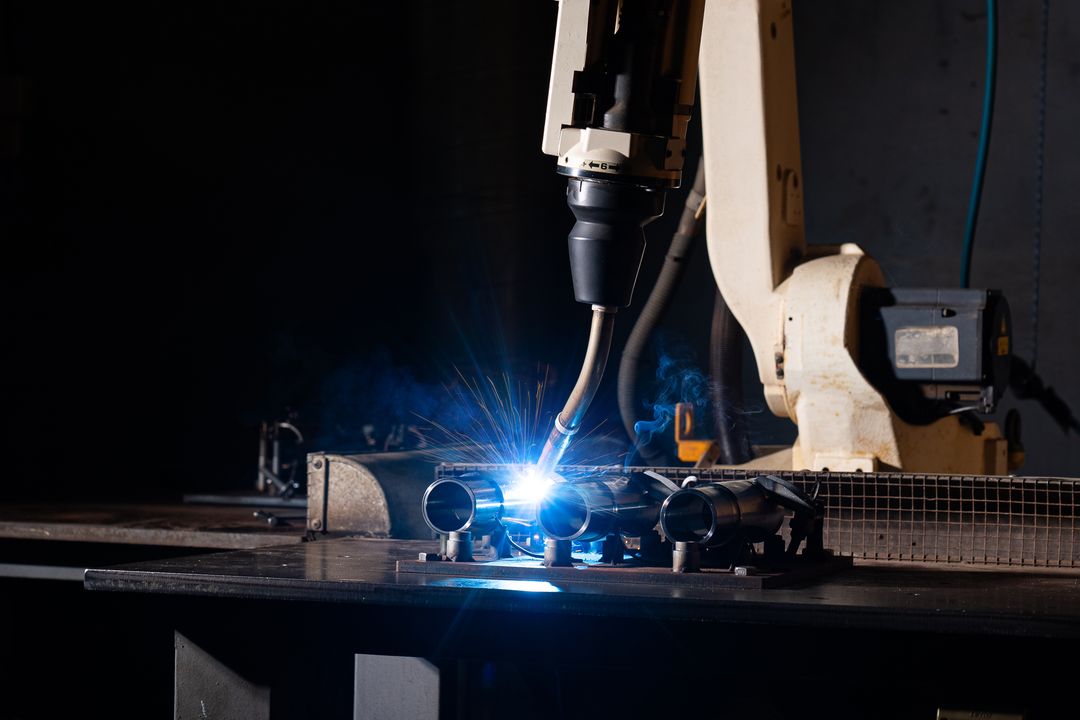 Robotic welding of coilover parts